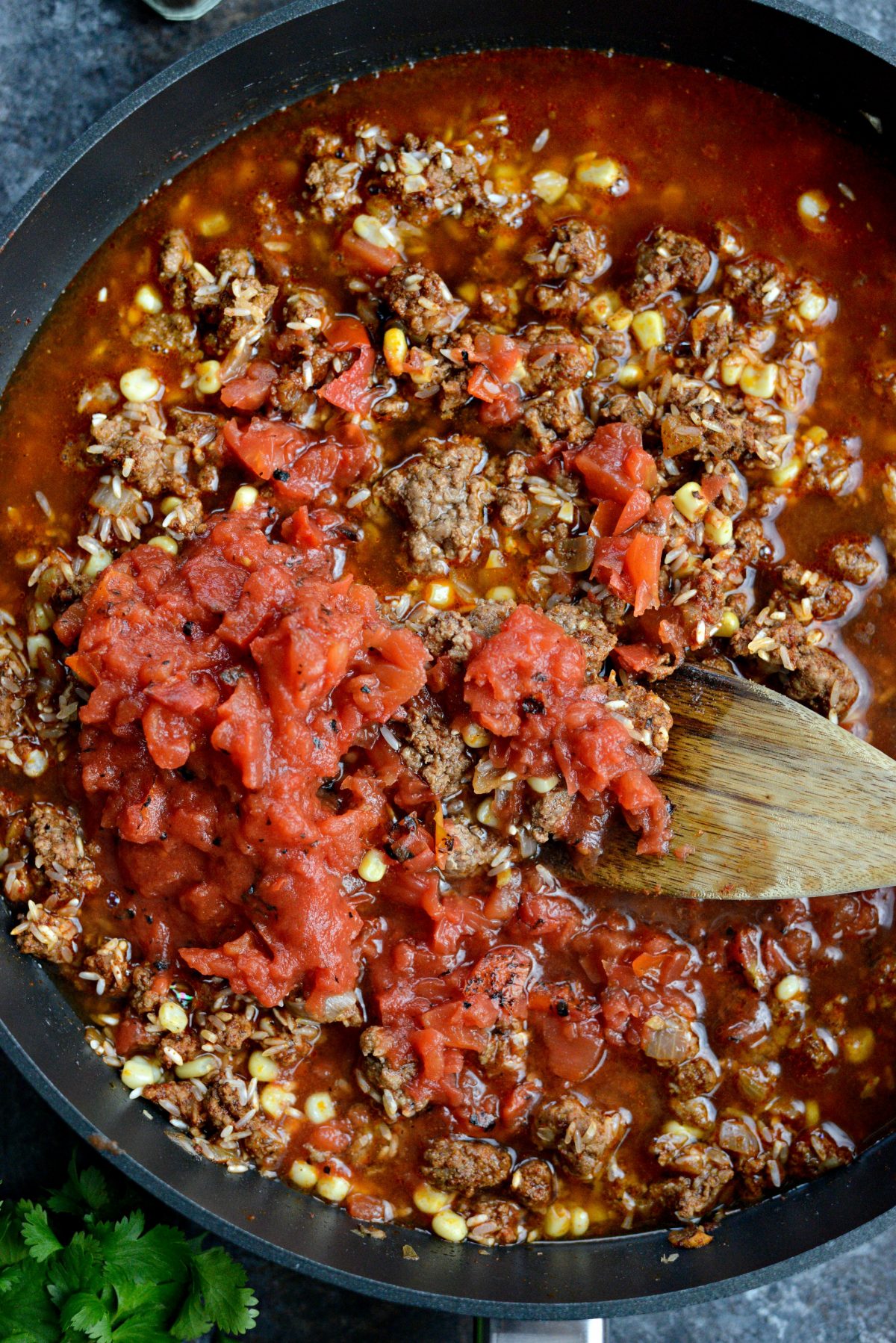 Add fire-roasted tomatoes and beef broth.
