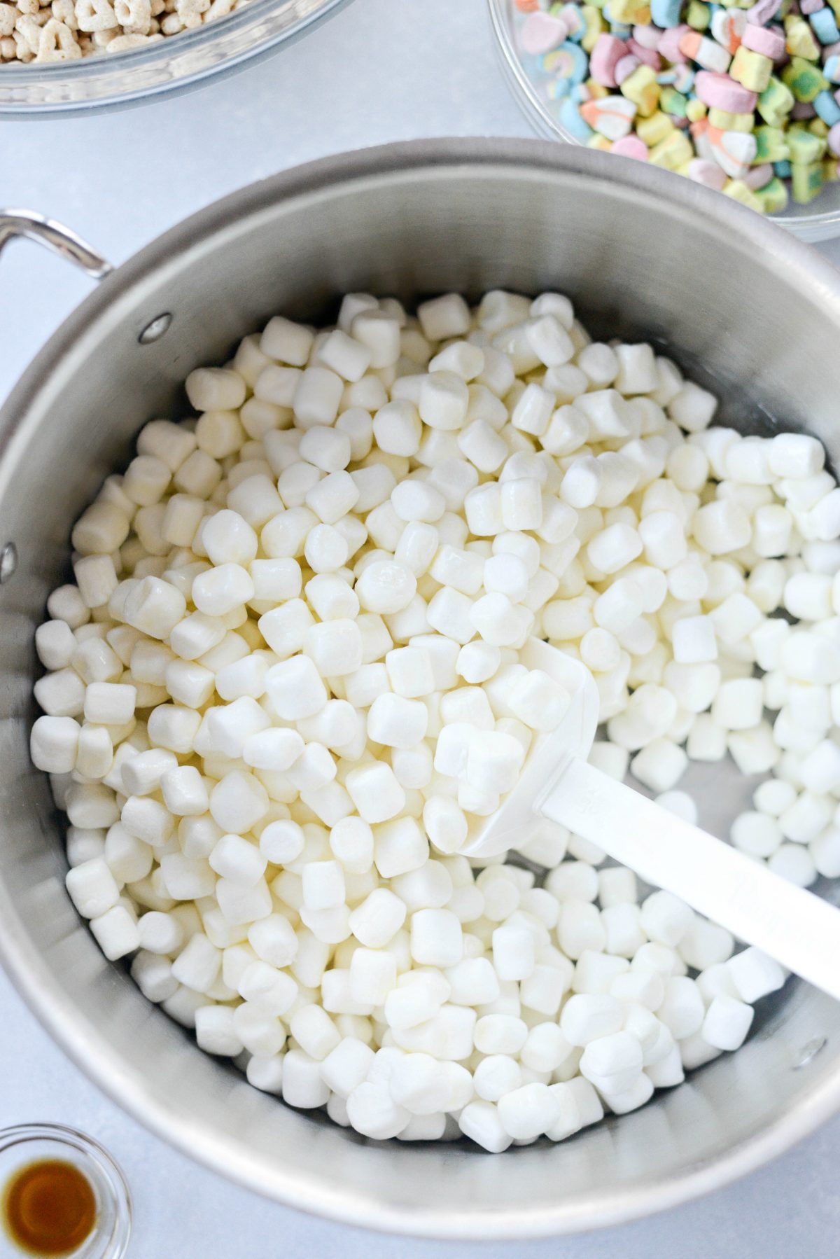 stirring marshmallows with the butter.