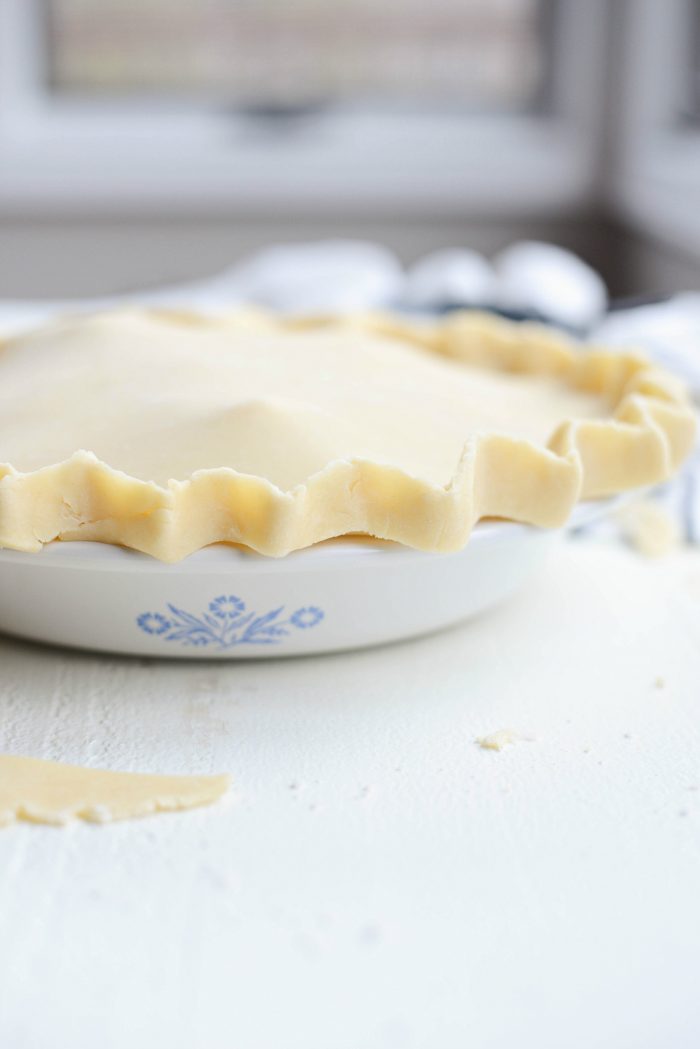 fill bottom pie crust and roll out and top with second disc.