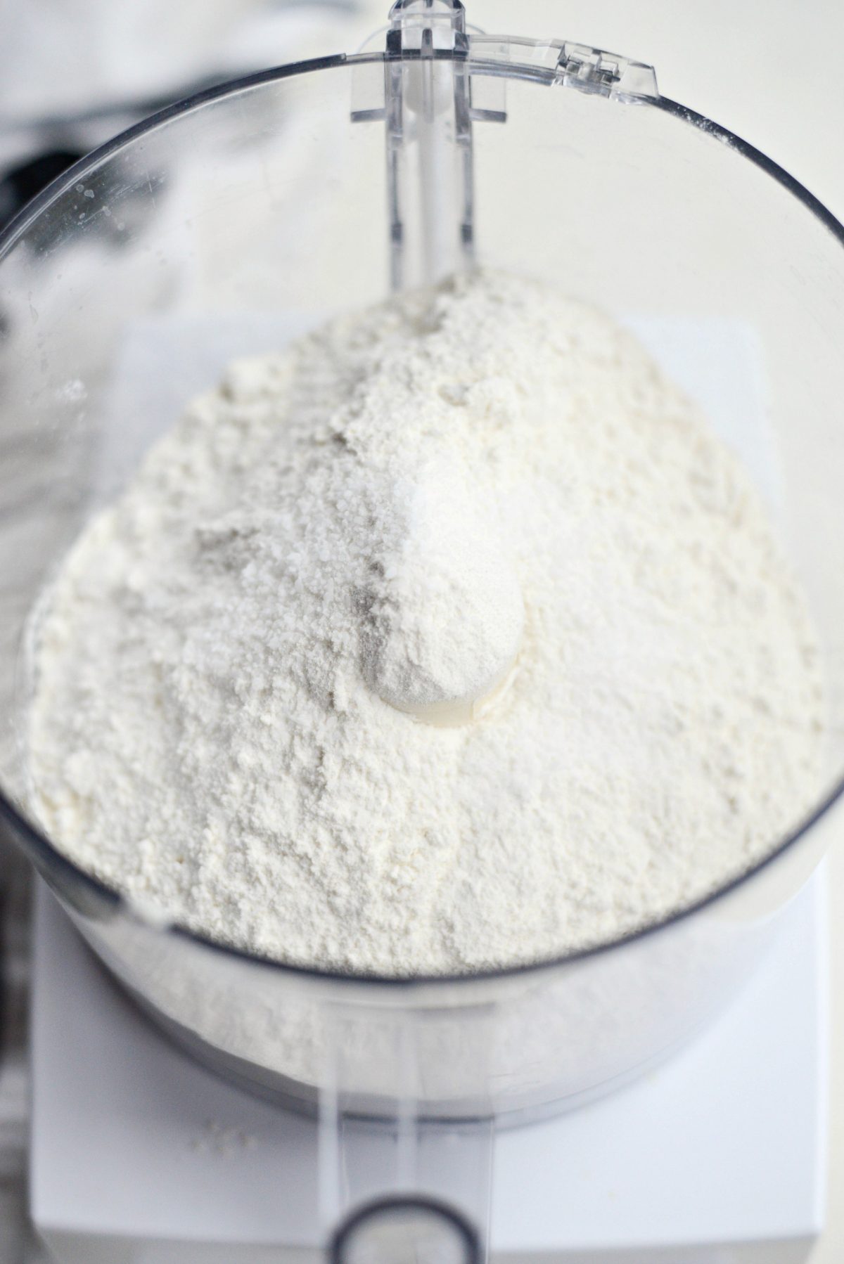 dry ingredients in food processor fitted with the blade attachment.