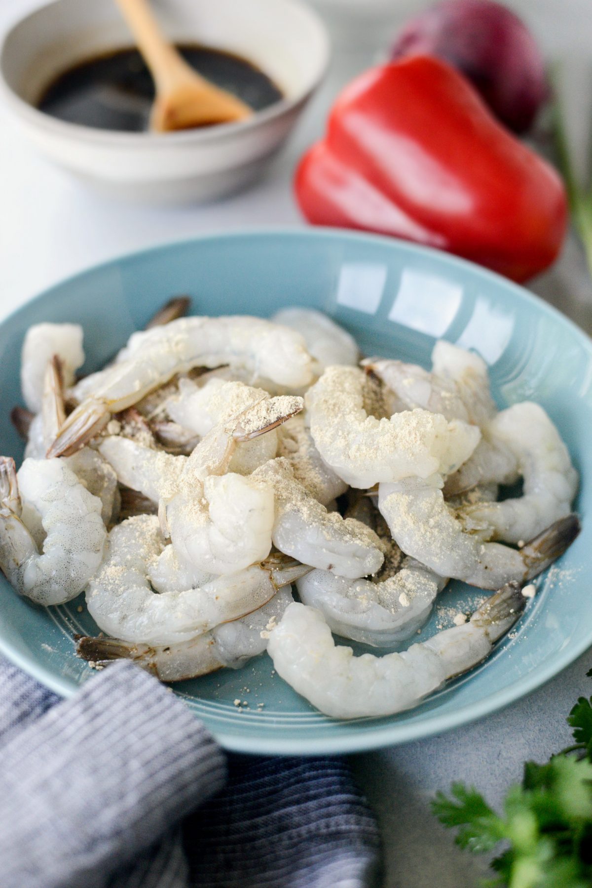 shrimp in blue bowl with white pepper