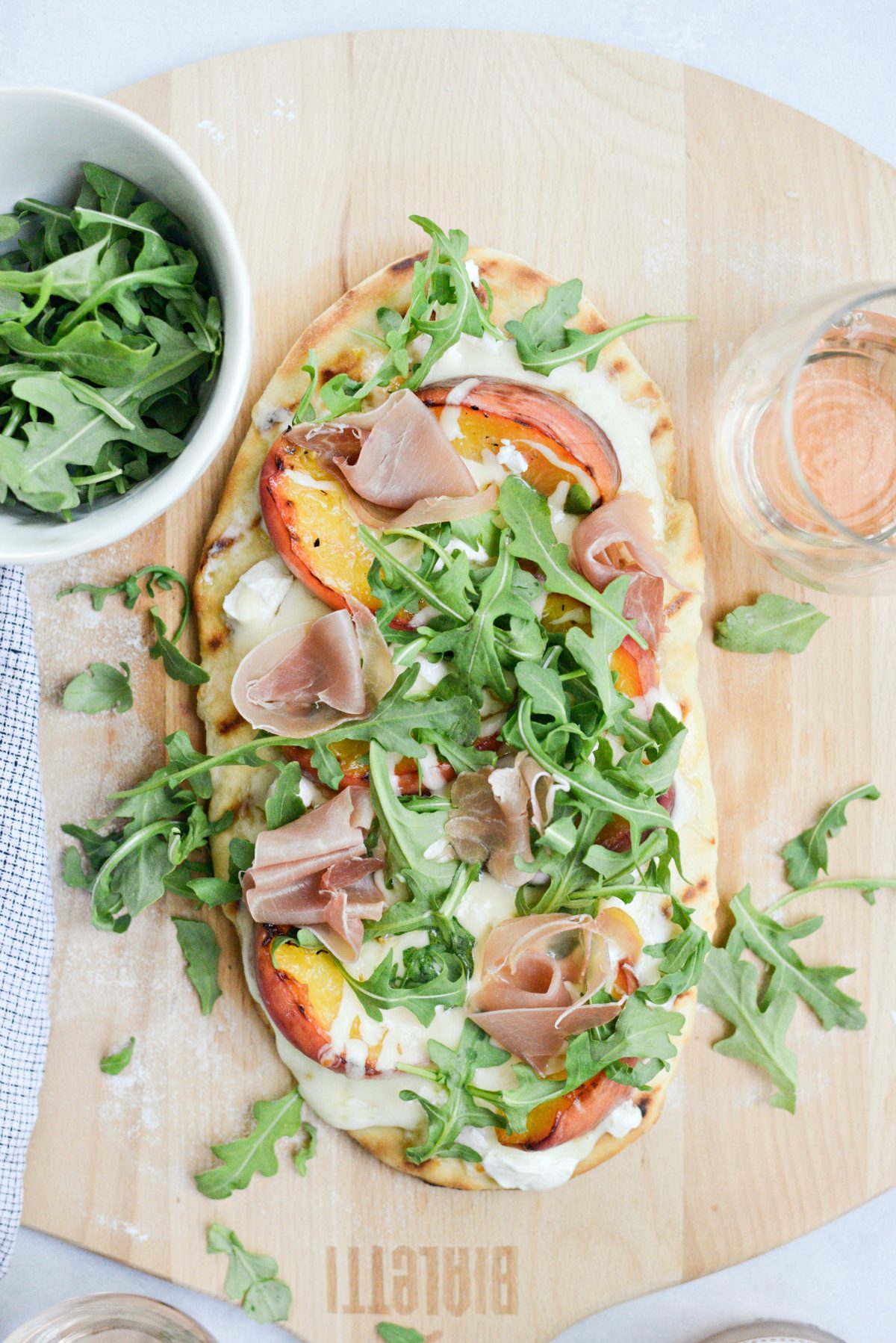 Top with prosciutto and arugula