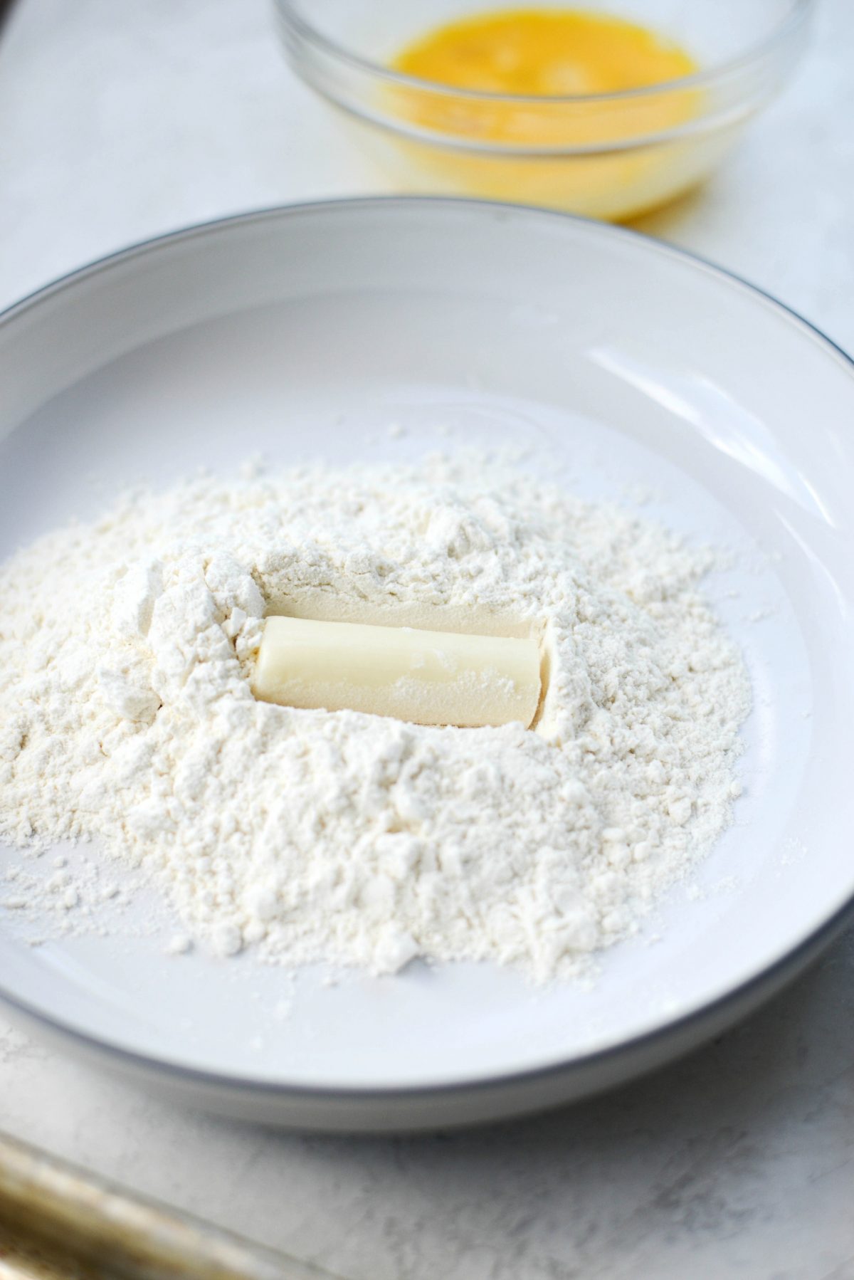 roll mozzarella stick in flour