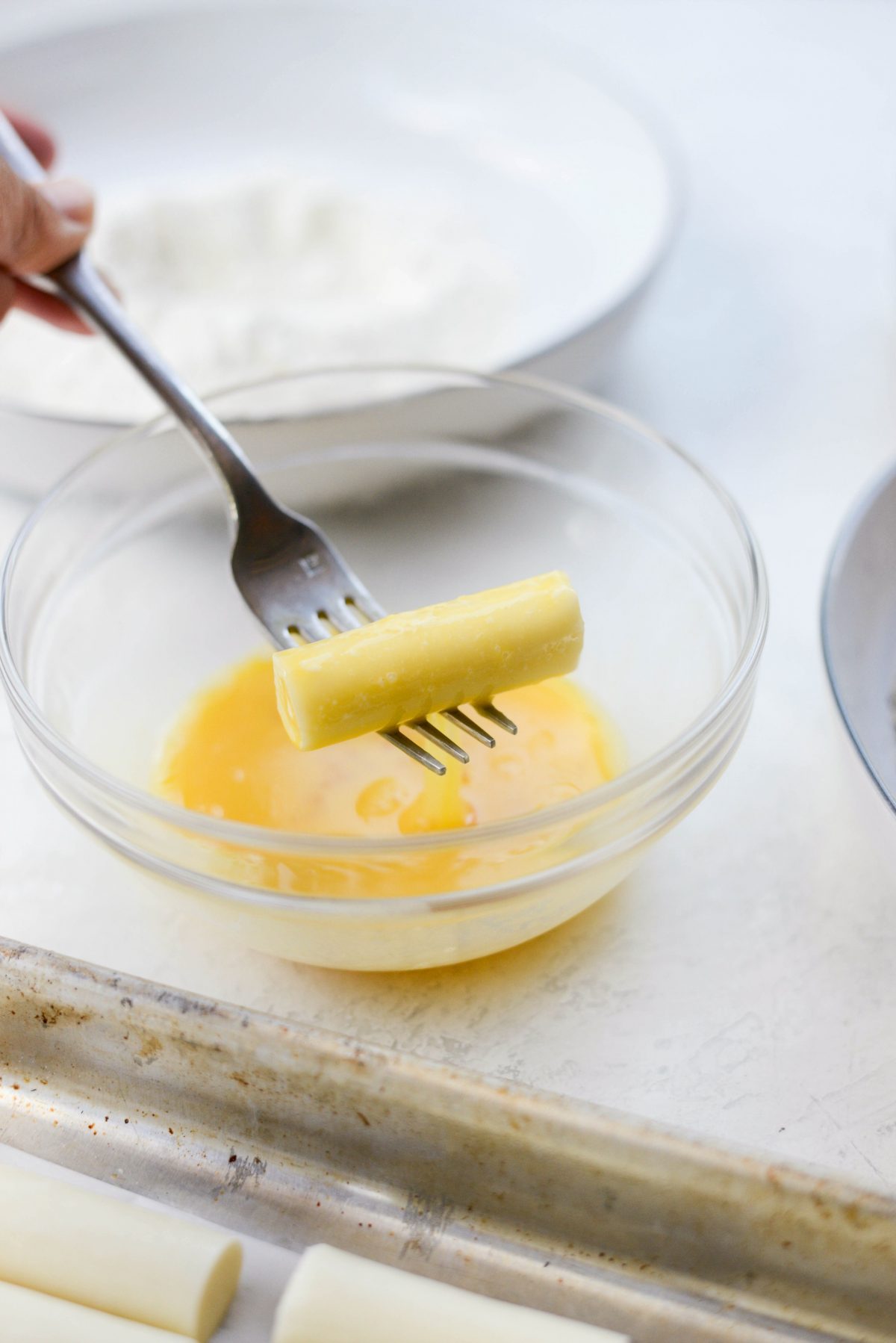 drain off excess egg back into the bowl.