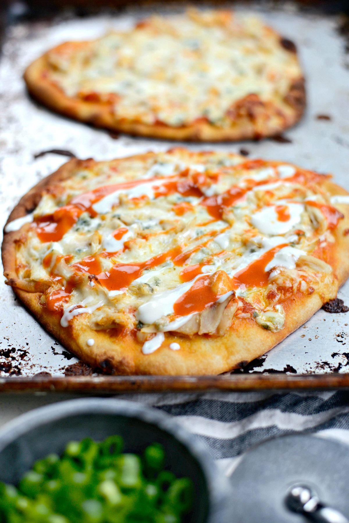 Buffalo Chicken Flatbread Pizzas with buffalo sauce and blue cheese dressing.