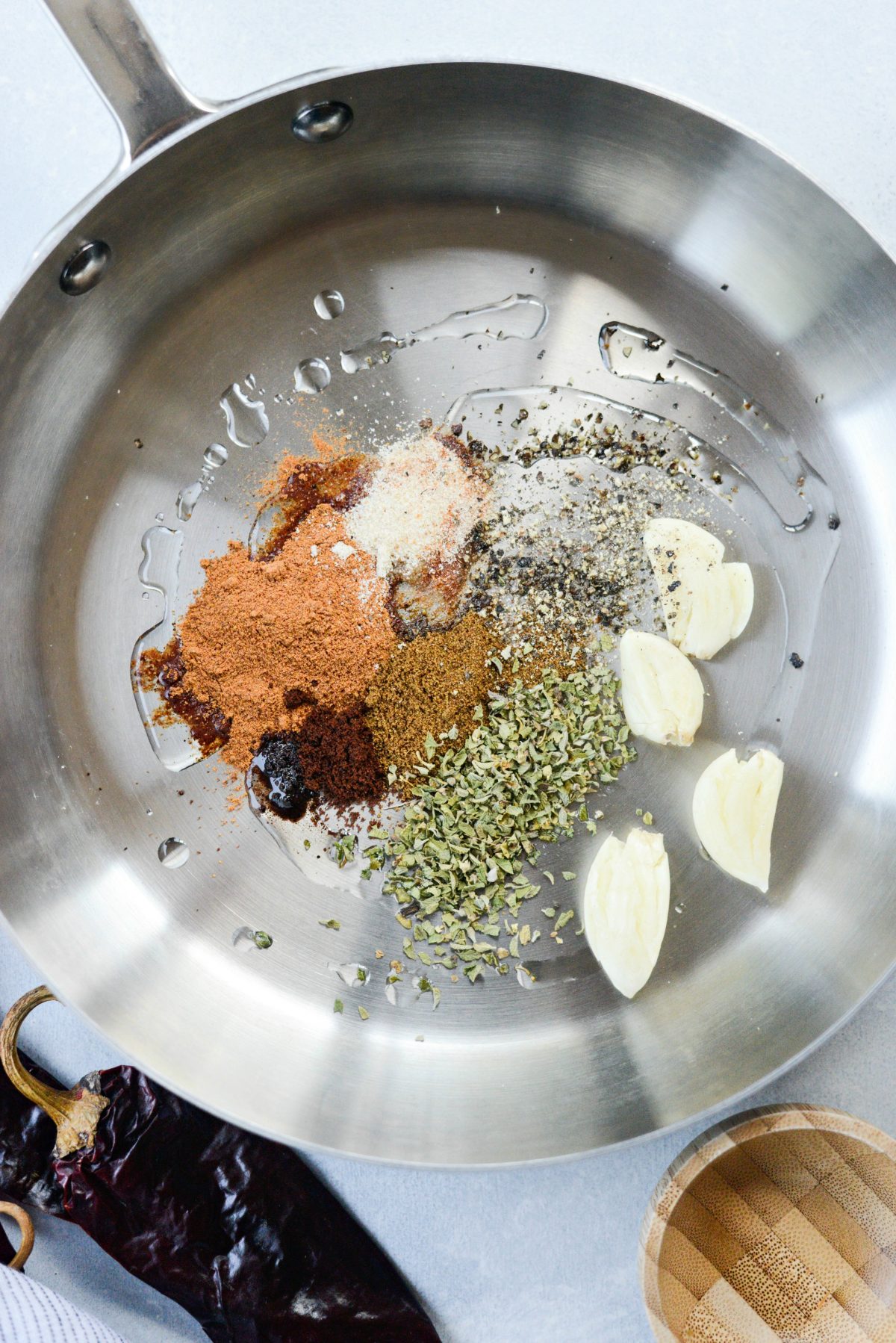 oil, spices and garlic in skillet