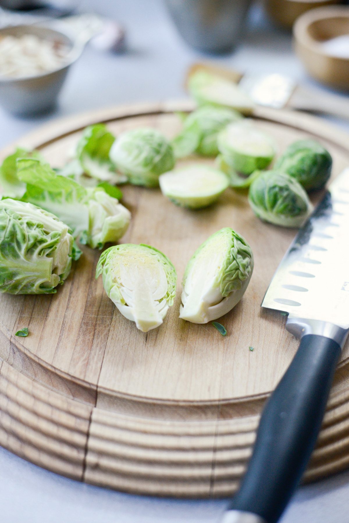 remove brussels outer leaves and cut in half