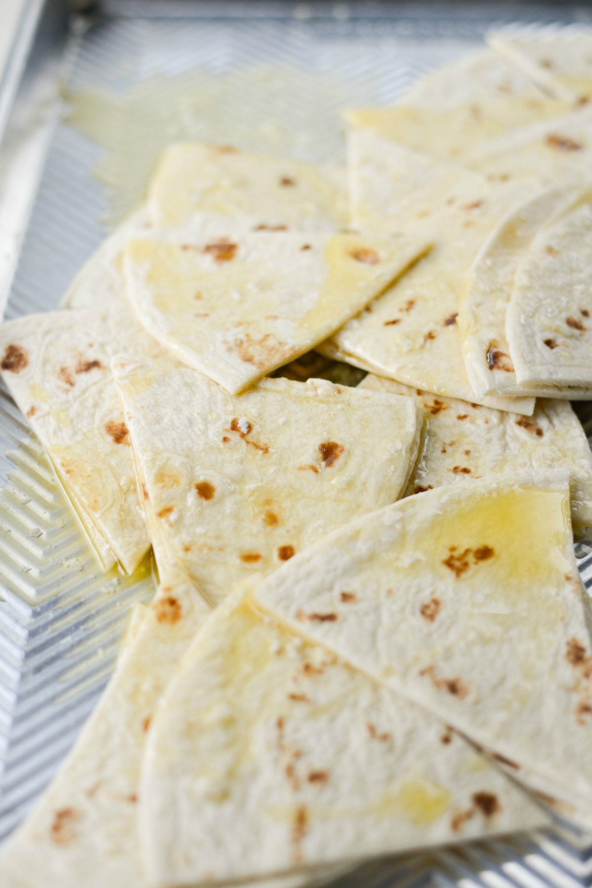 buttered tortilla triangles