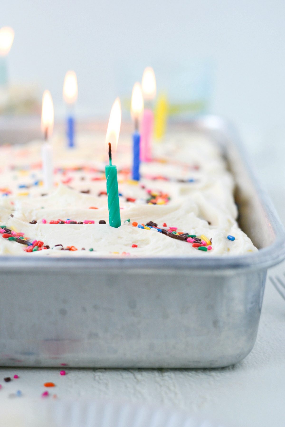 lit candles in Homemade Funfetti Cake