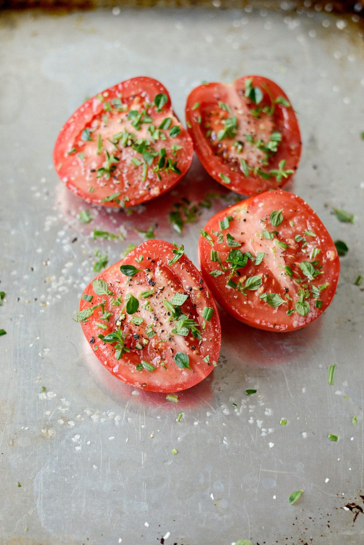 roma tomatoes seasoned with olive oil, salt and pepper and fresh thyme