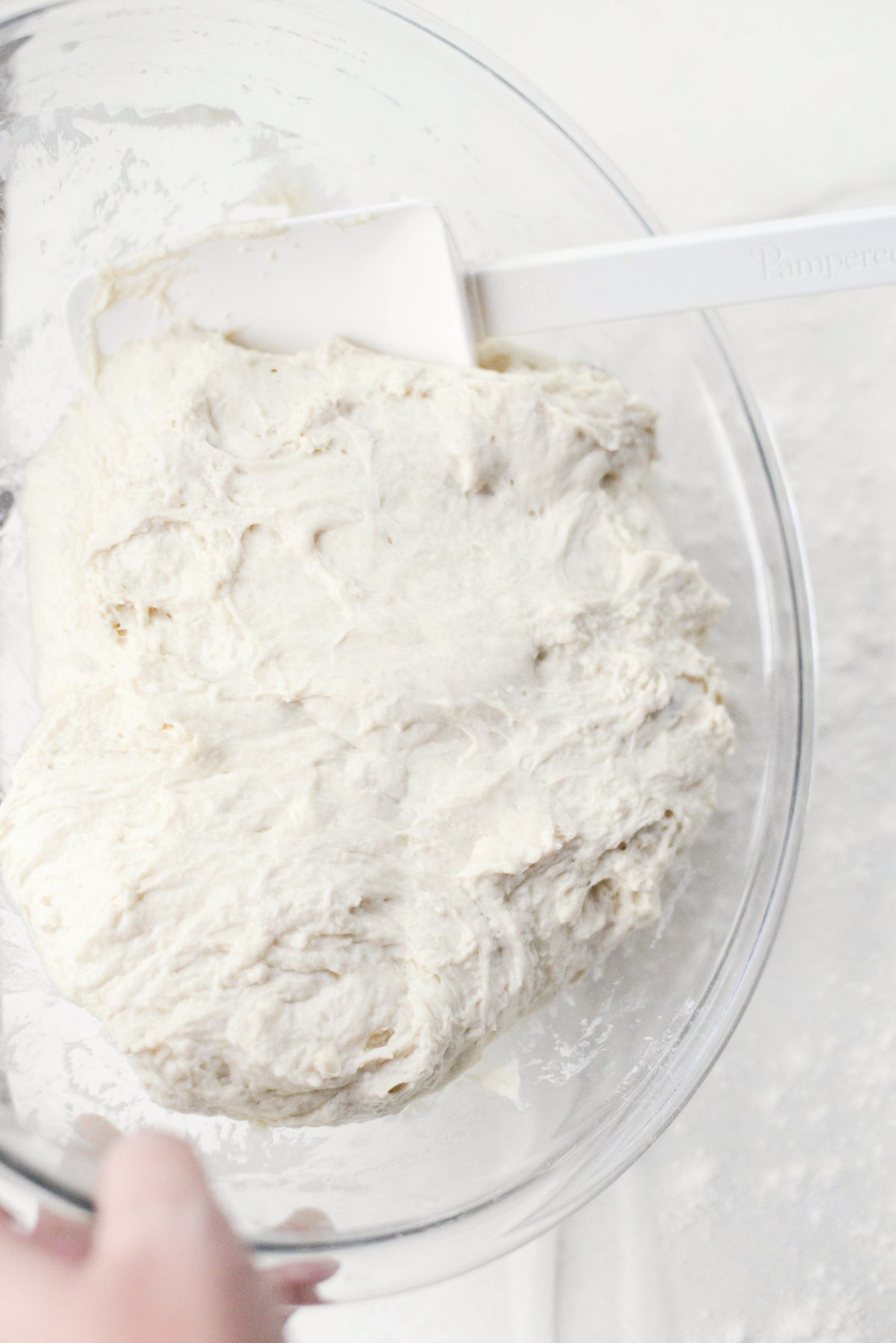 scrape dough onto floured surface
