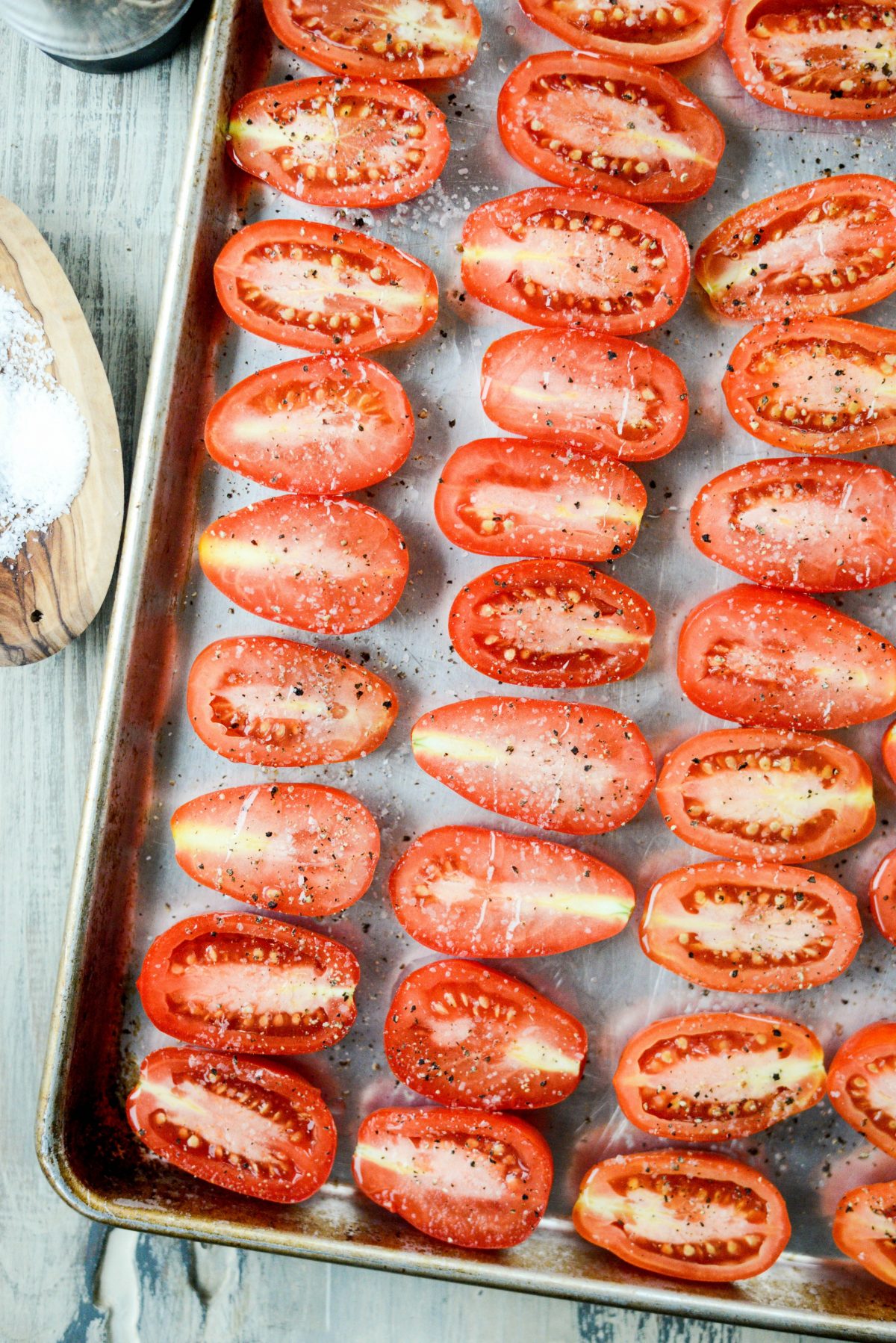 seasoned tomatoes on a sheet pan