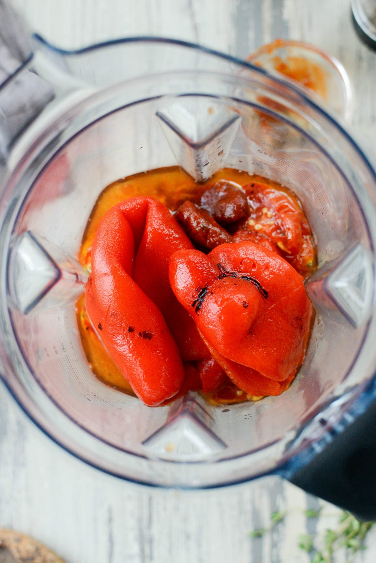 add roasted tomatoes and peppers to a blender
