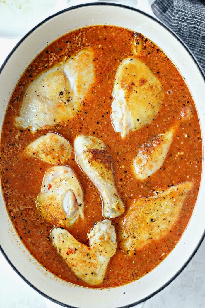 add seared chicken back into the pot and cook.