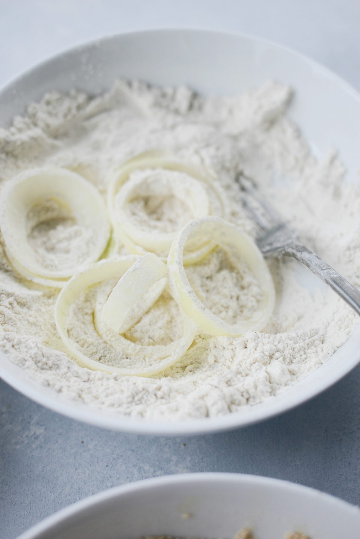 for extra crispy onion rings, dip onion slices in flour