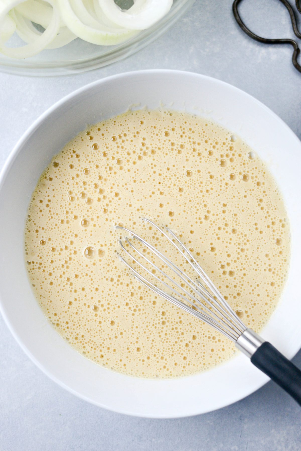 whisked egg and beer in bowl