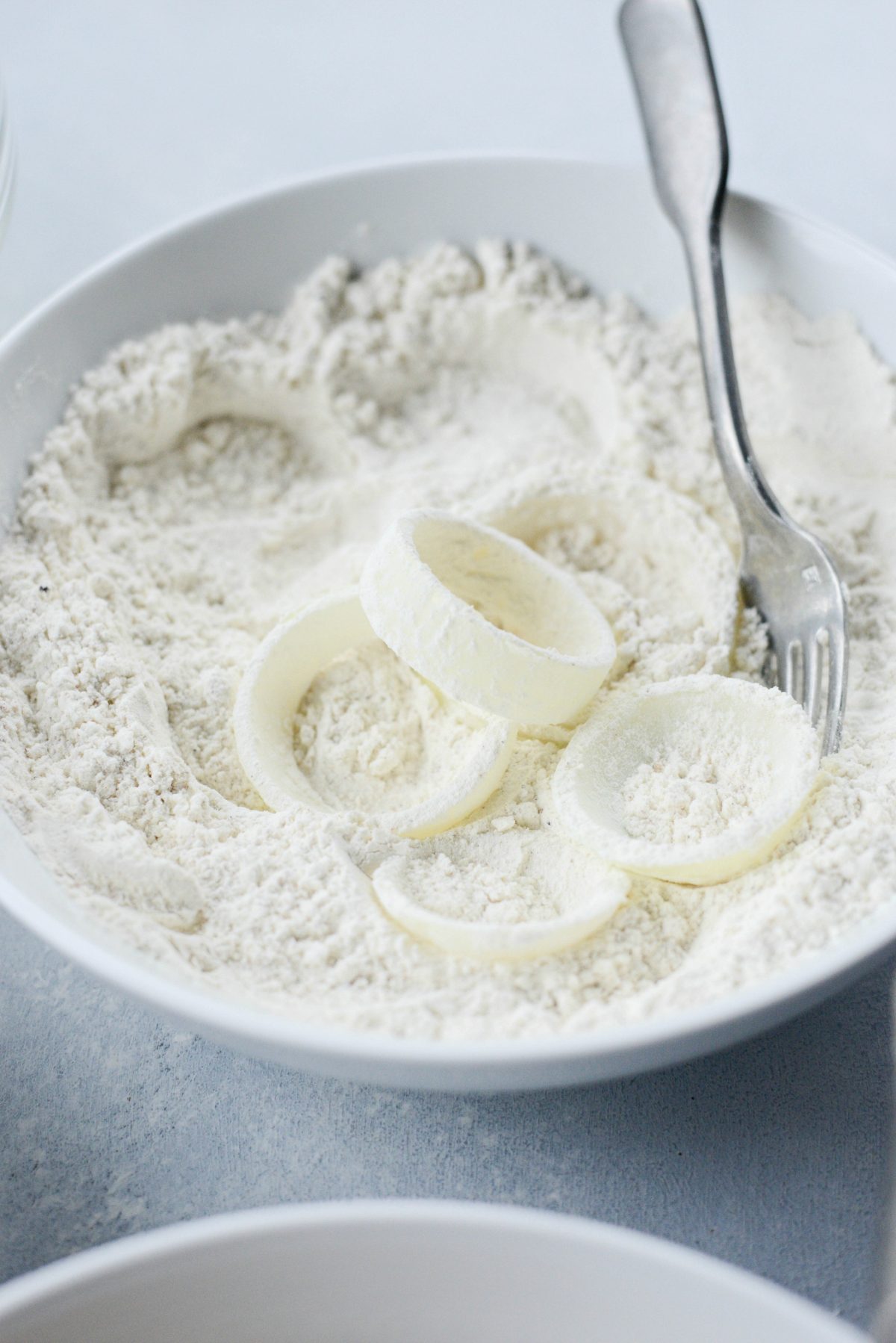 dip thick cut onions first in flour