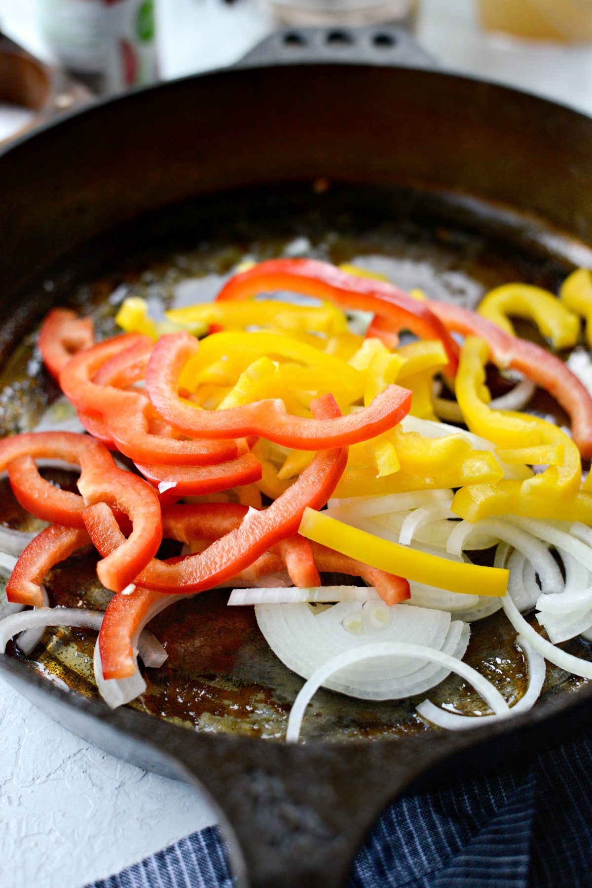 remove browned andouille and add onions and peppers to skillet.