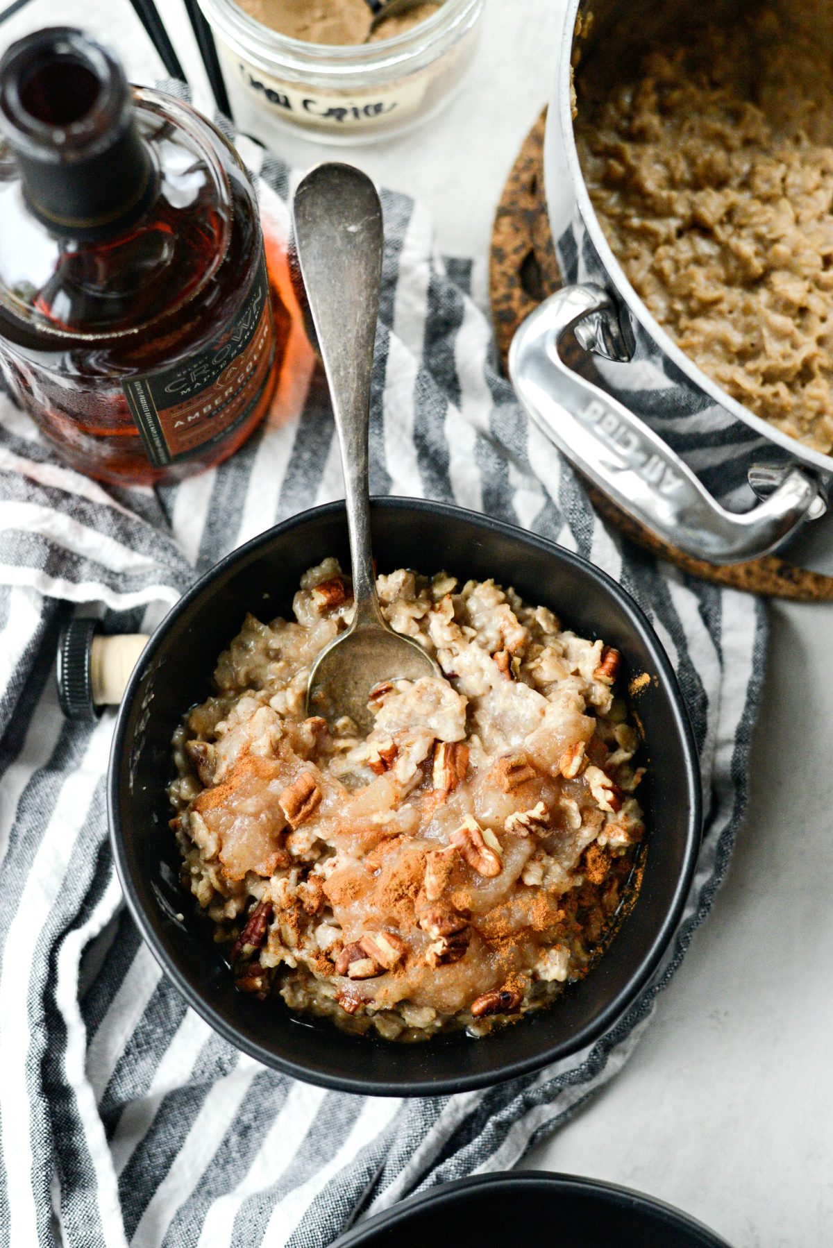Apple Chai Oatmeal in bowl with spoon.