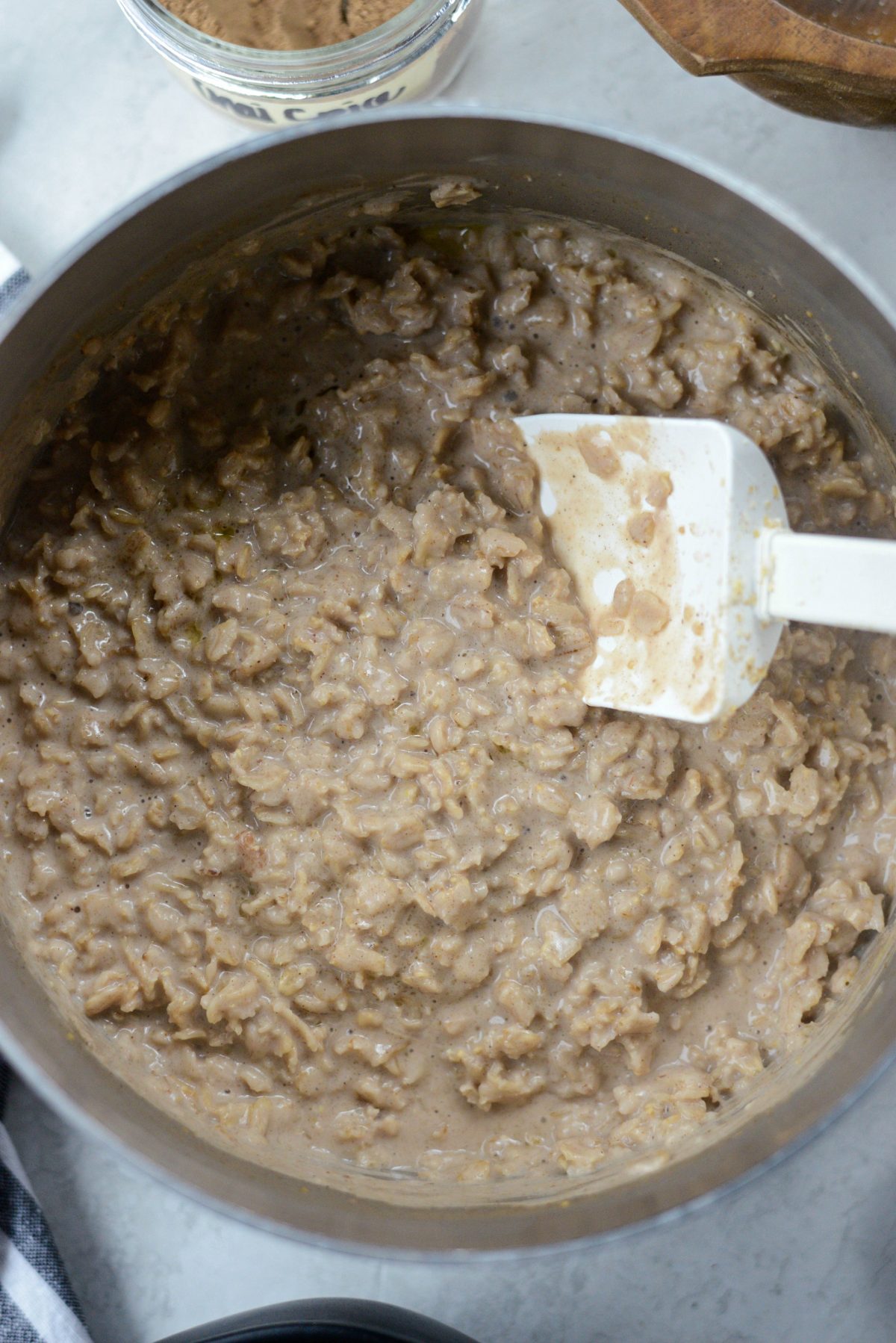 creamy apple chai oatmeal in pan.