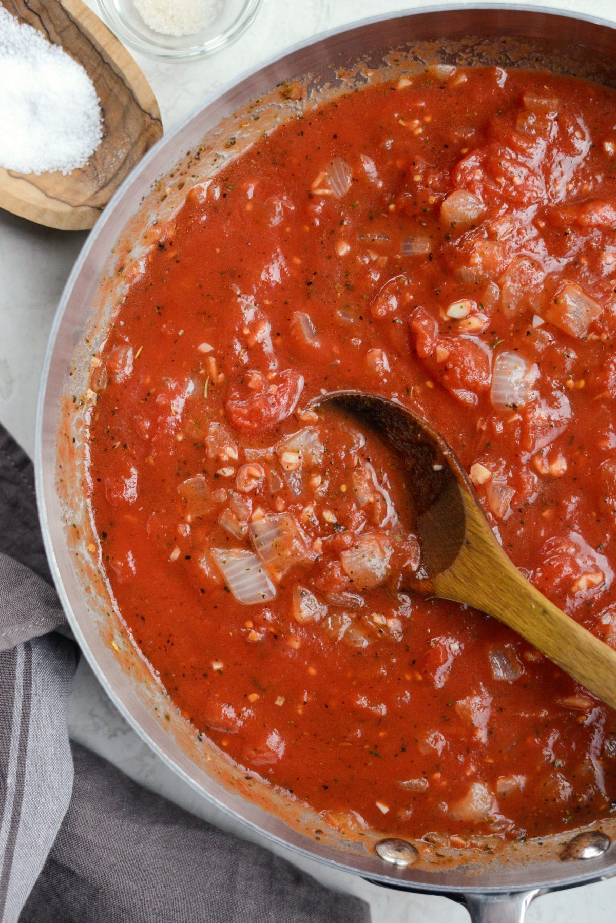 break up San Marzano tomatoes and simmer sauce.