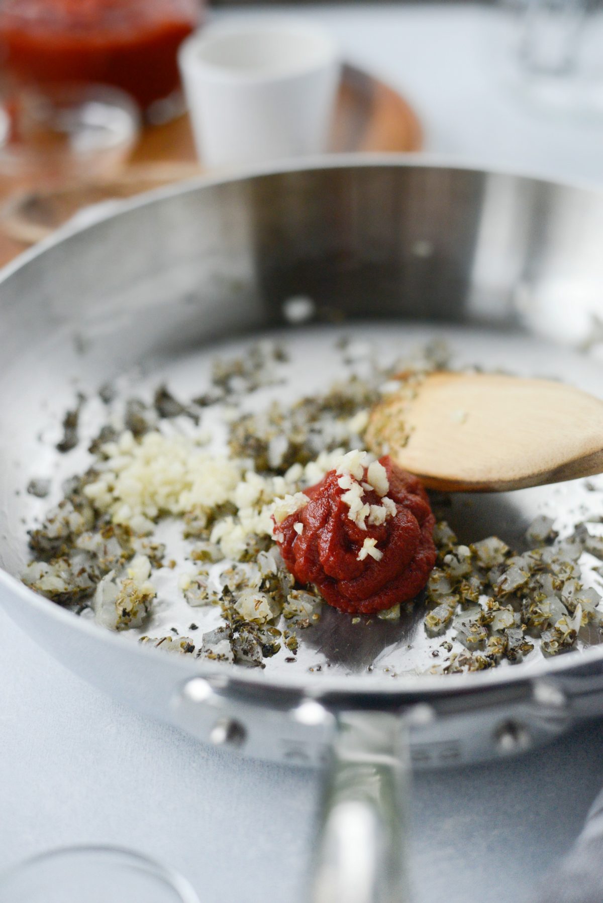 add tomato paste and minced fresh garlic.
