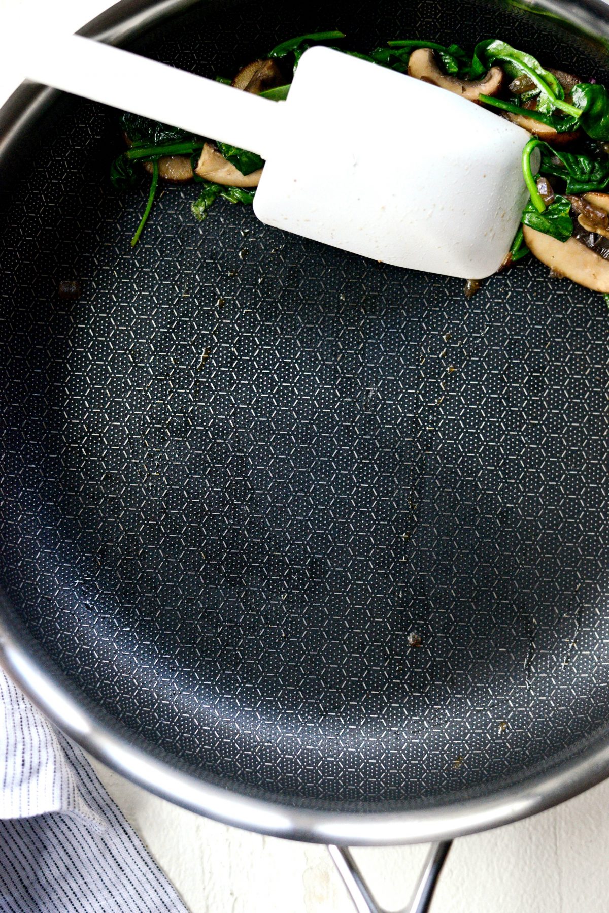 scoot mushroom / spinach mixture off to the side of your pan.