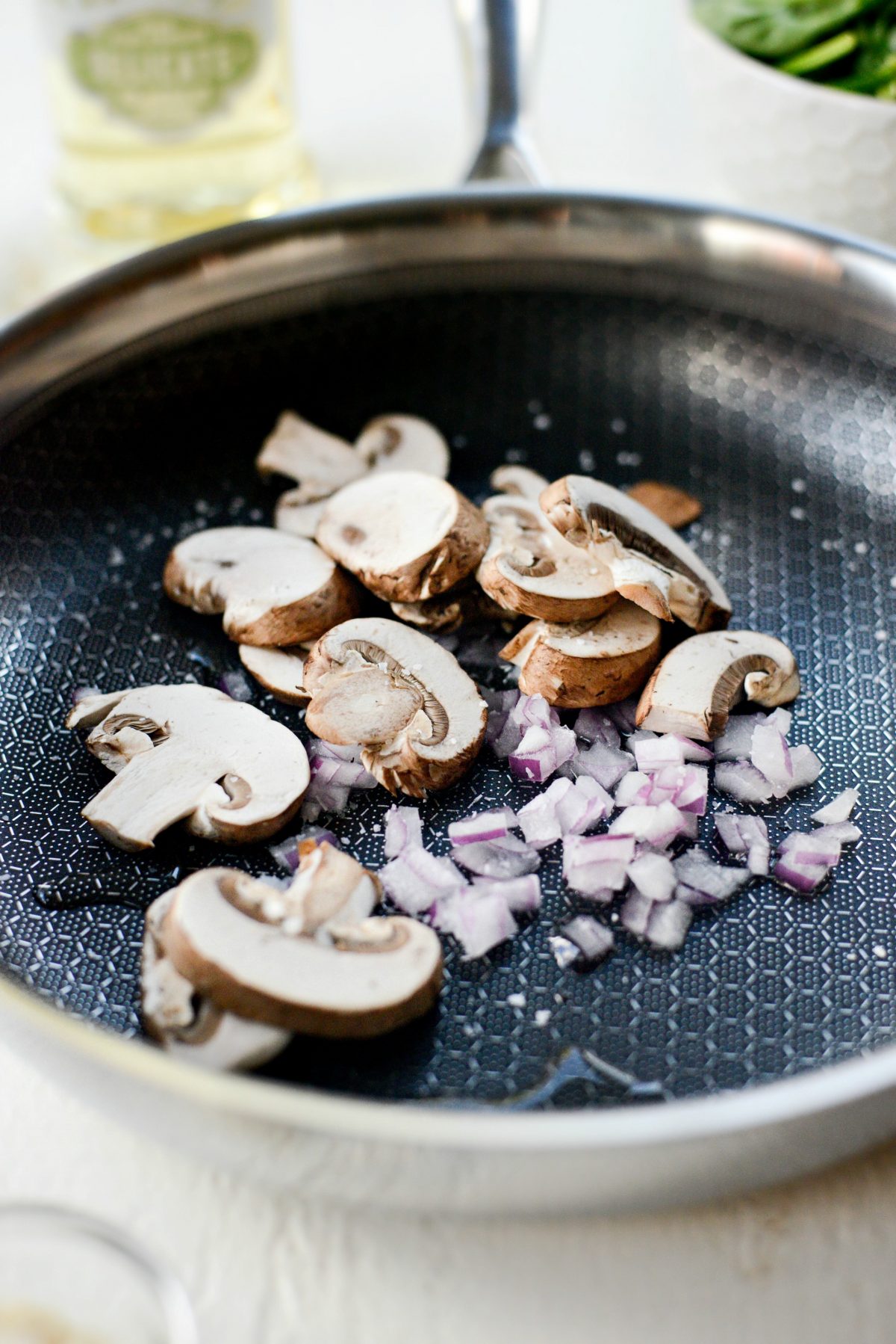 add onion, mushrooms and a pinch of salt