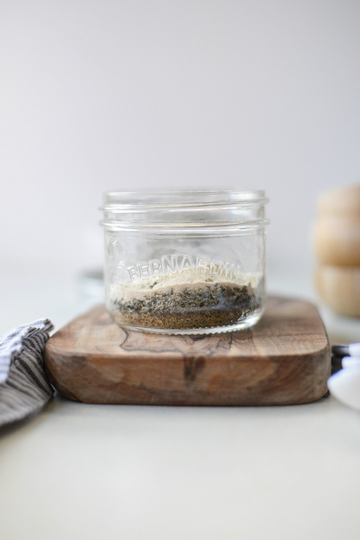 layered herbs and spices in a jar