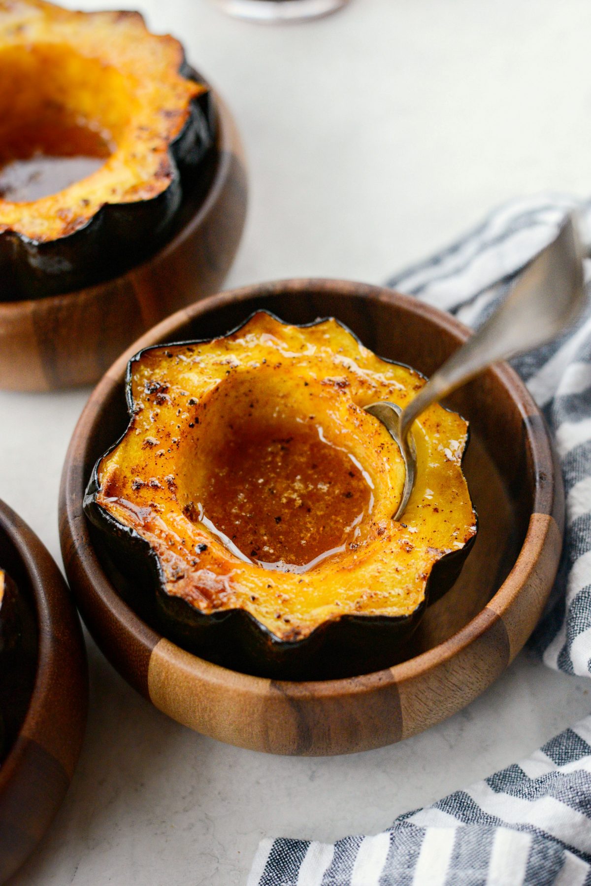spoon in Maple Butter Roasted Acorn Squash 