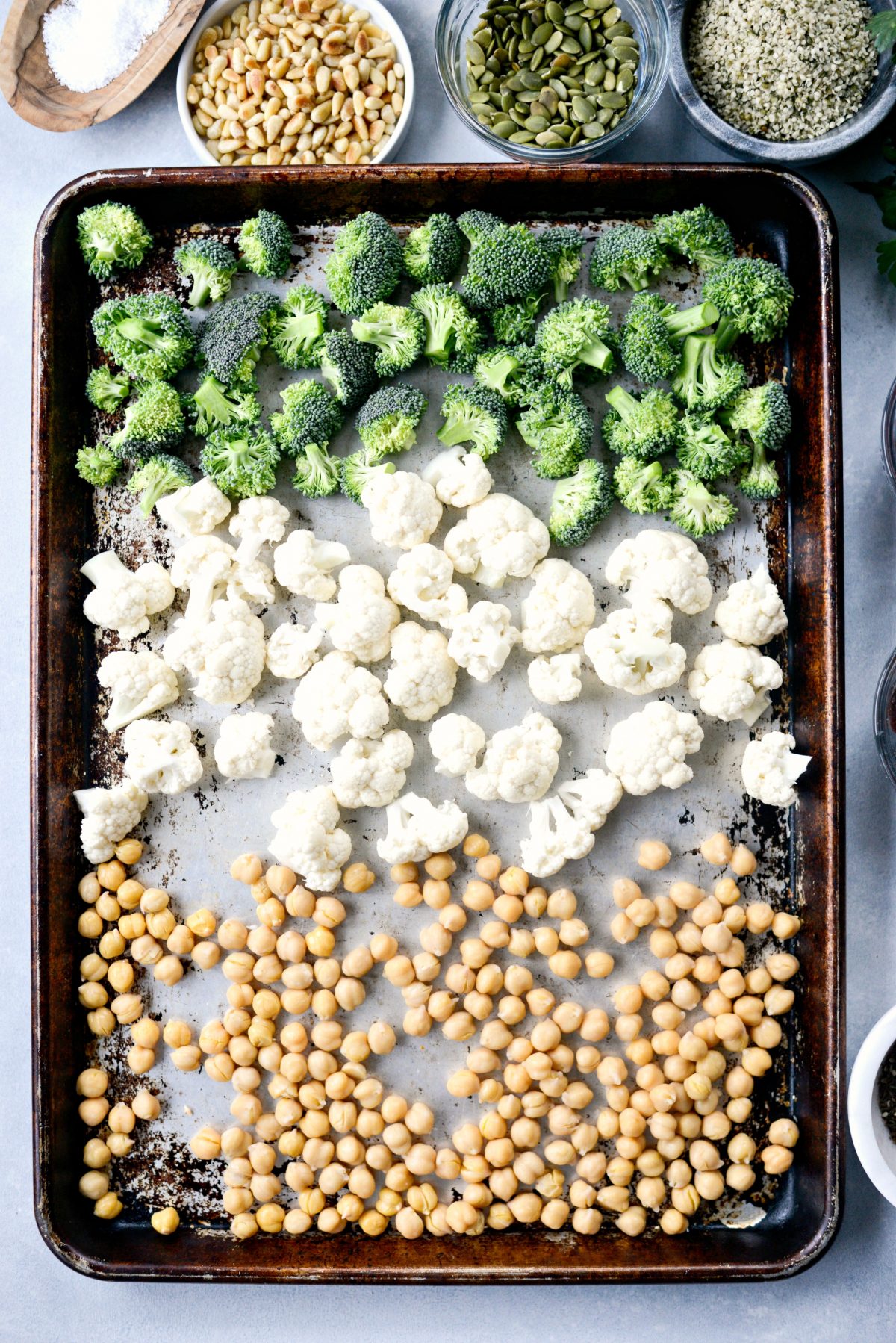 broccoli, cauliflower and chickpeas on a rimmed sheet pan
