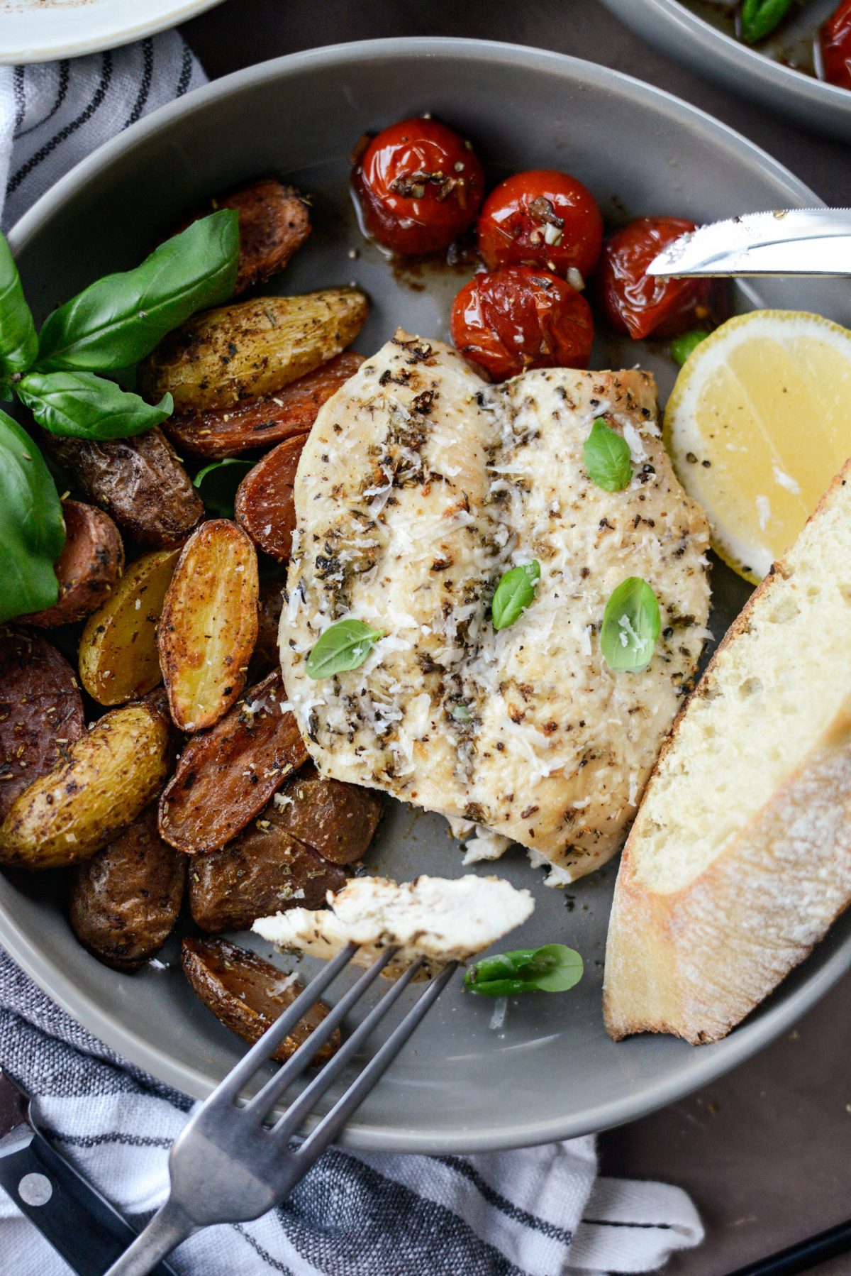 Tuscan Chicken and Potato Sheet Pan Dinner with Balsamic Burst Tomatoes close up
