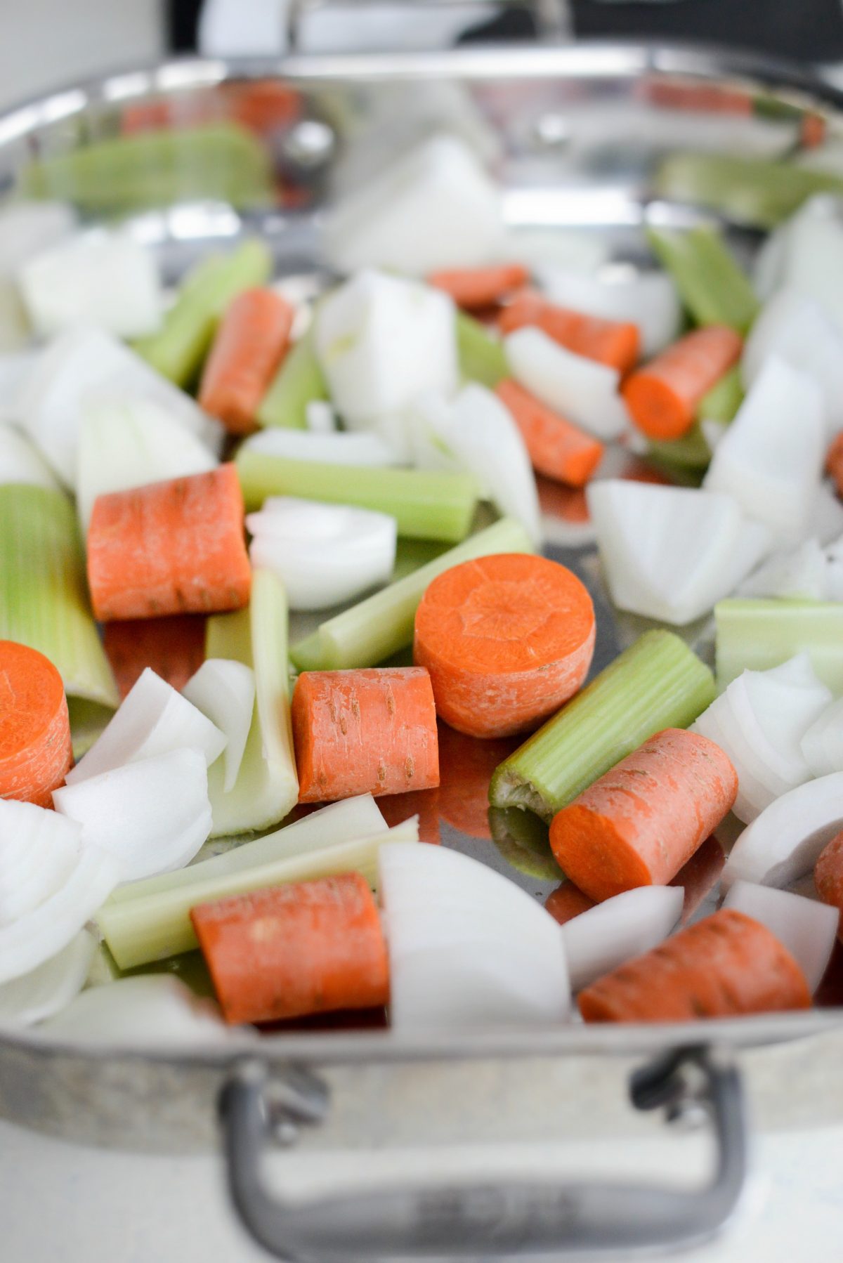 chopped vegetables in a roasting pan