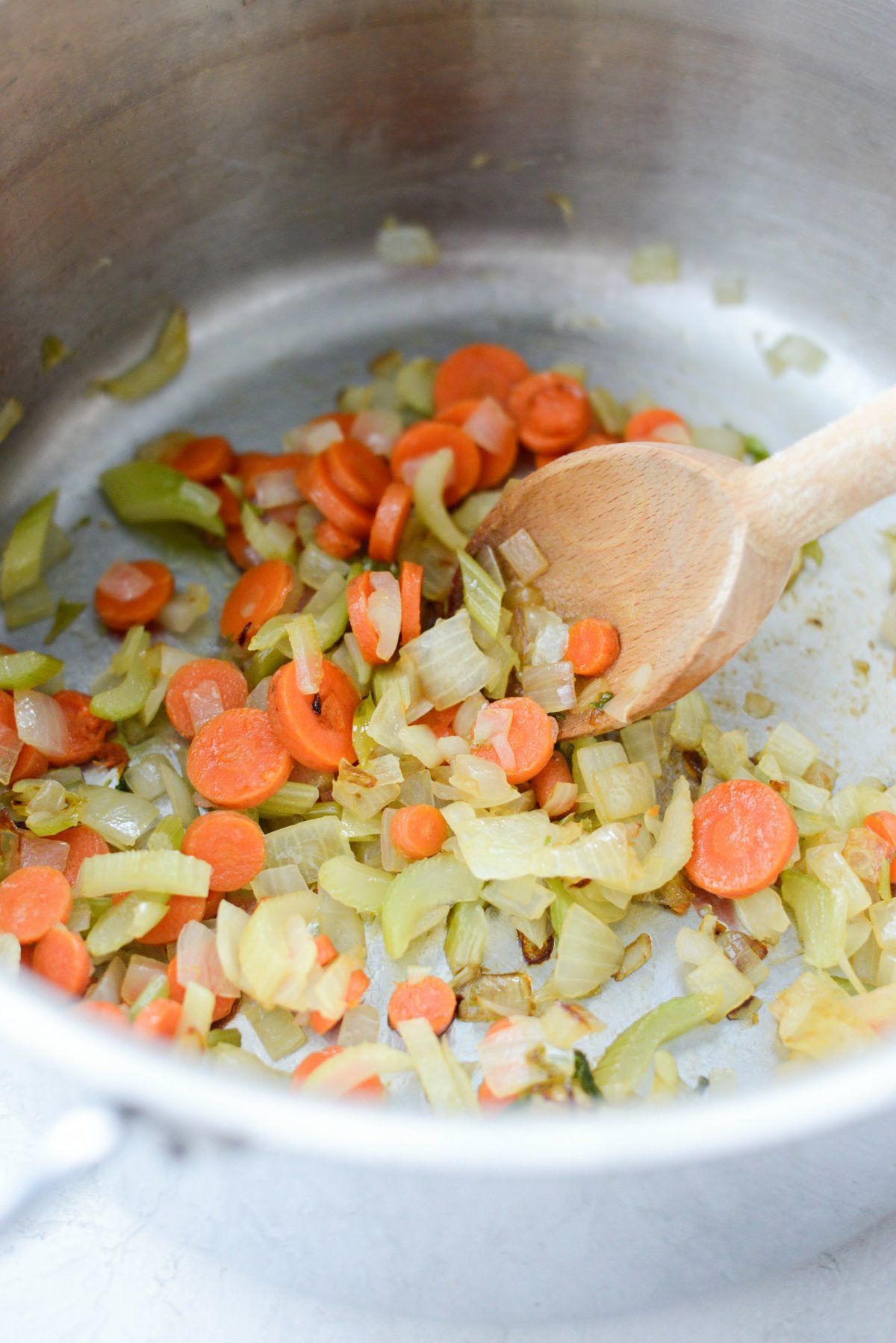 sautéed vegetables in pot.