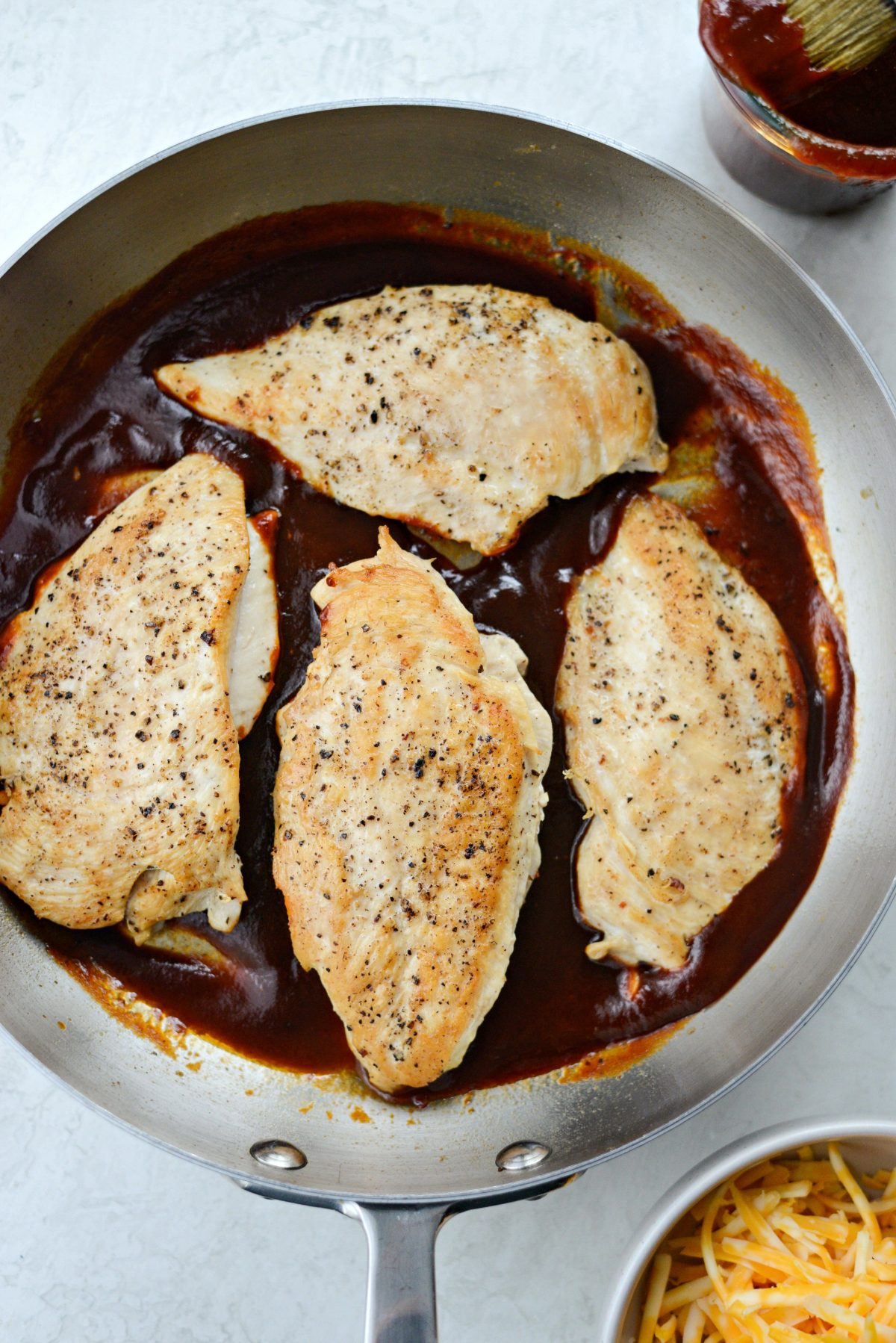 add chicken breasts back into the skillet 