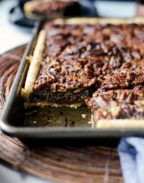 Gingerbread Pecan Slab Pie with piece missing