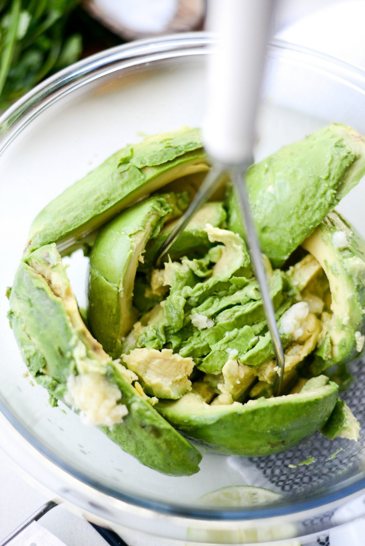 mash together the avocado, lime juice and garlic