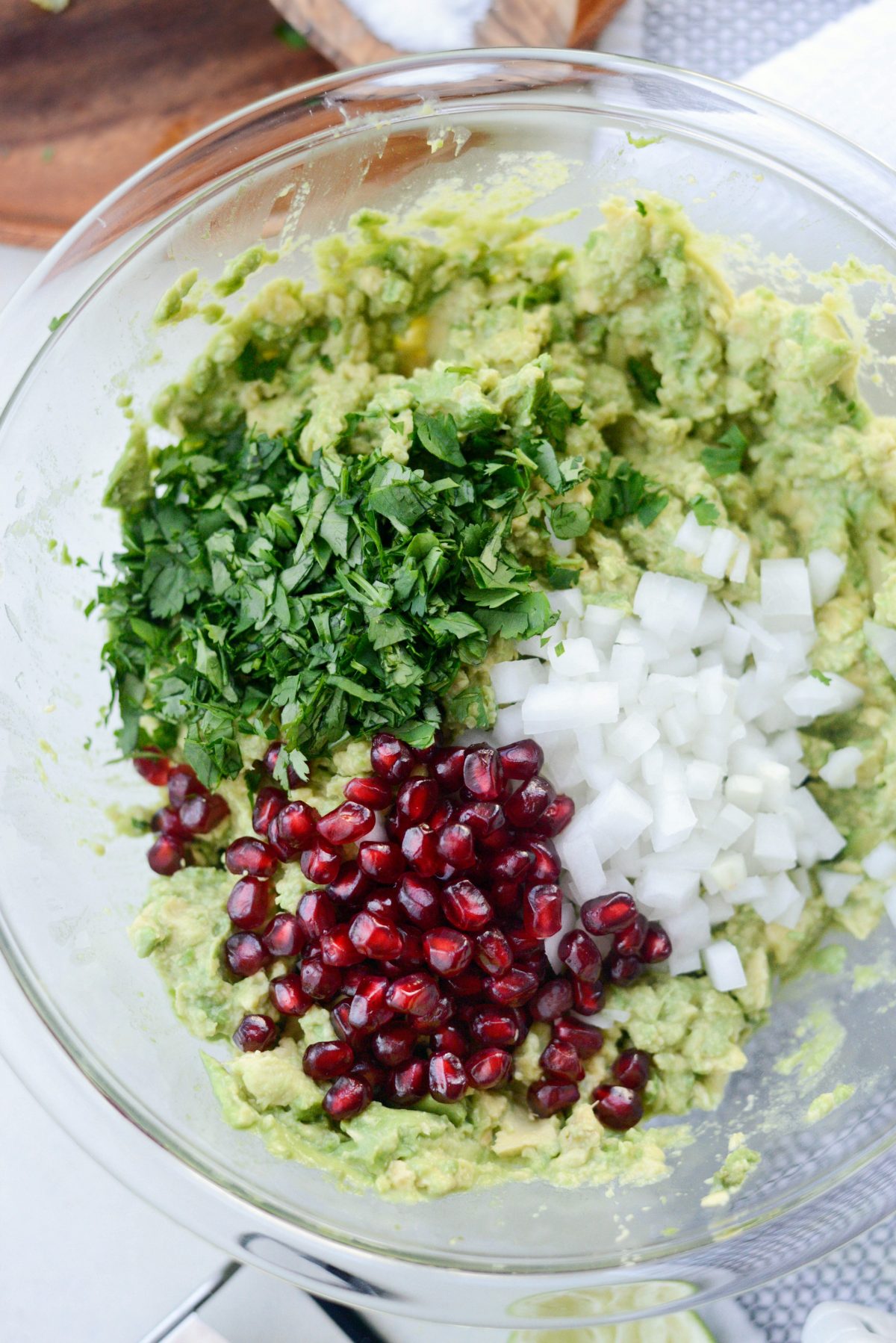 add in pomegranate arils, white onion and cilantro