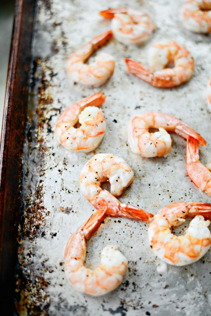 Squeeze lemon juice onto roasted shrimp