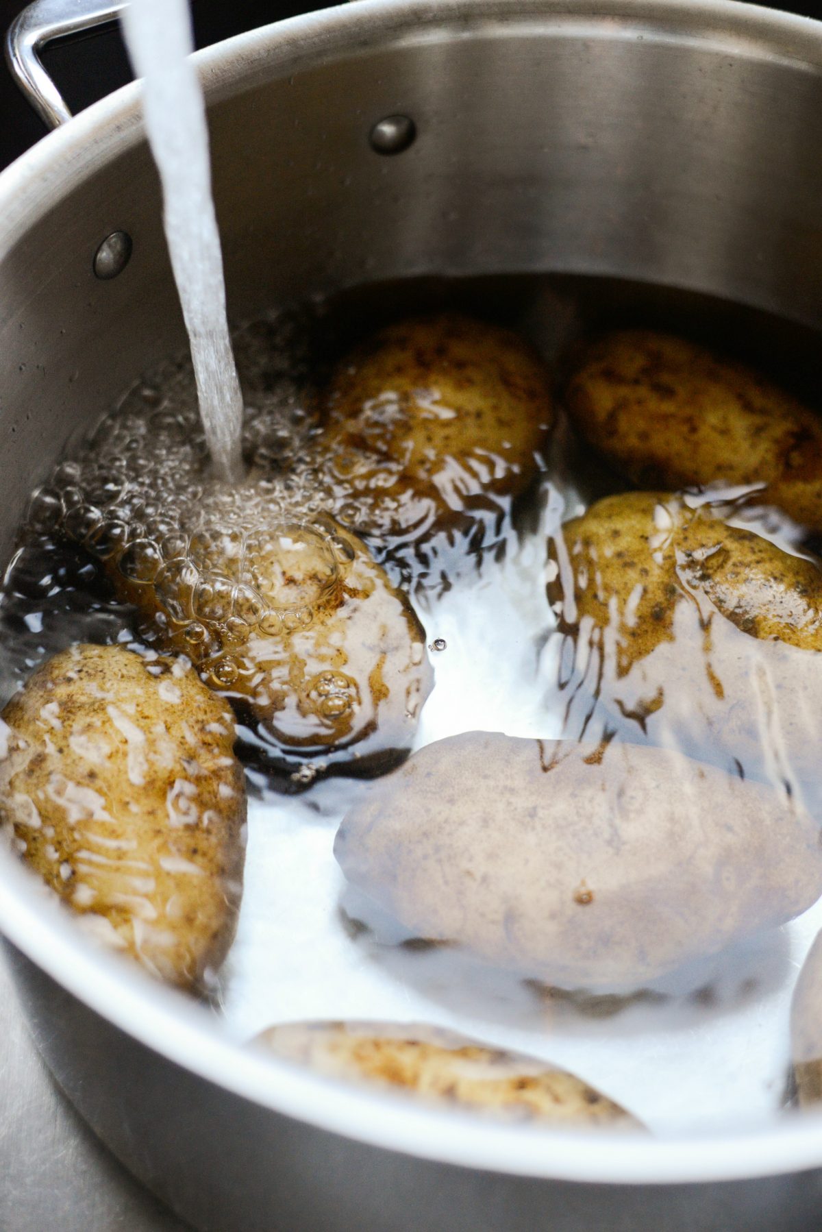 add potatoes to a pot with cool water