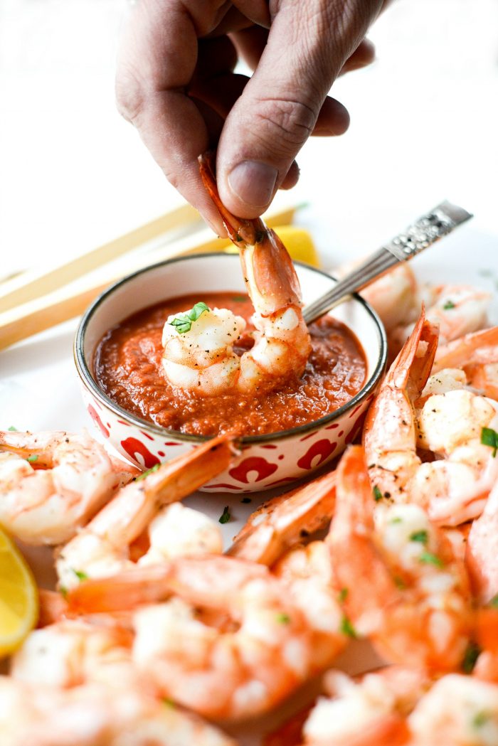 Dipping Roasted Shrimp in Homemade Cocktail Sauce