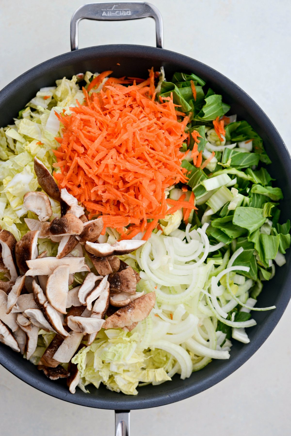 add veggies to wok