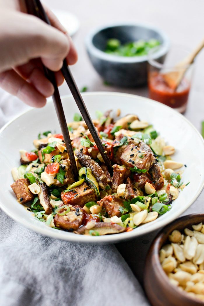 eating Crispy Peanut Tofu with Squash Noodles (Air Fryer) with chopsticks