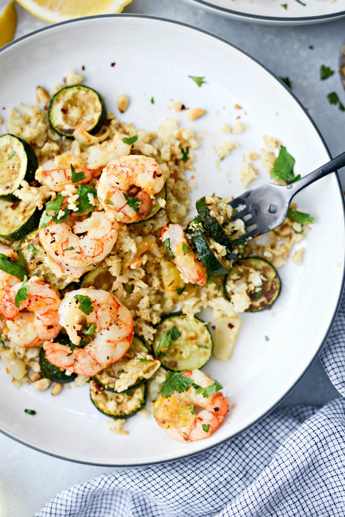 fork full of Sheet Pan Lemon Garlic Shrimp and Zucchini 