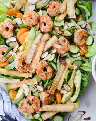 Grilled Asian Shrimp Salad with Crispy Wontons l SimplyScratch.com #shrimp #asian #salad #crispy #wonton #mandarin #oranges #toastedsesame #dressing #avocado