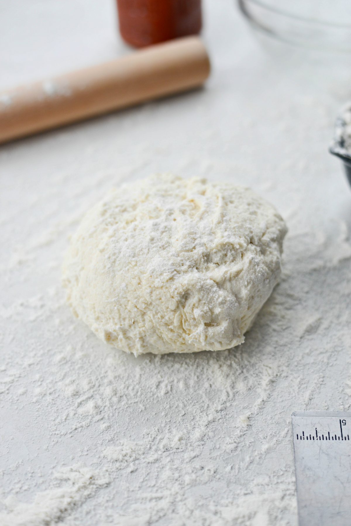 floured pizza dough ball