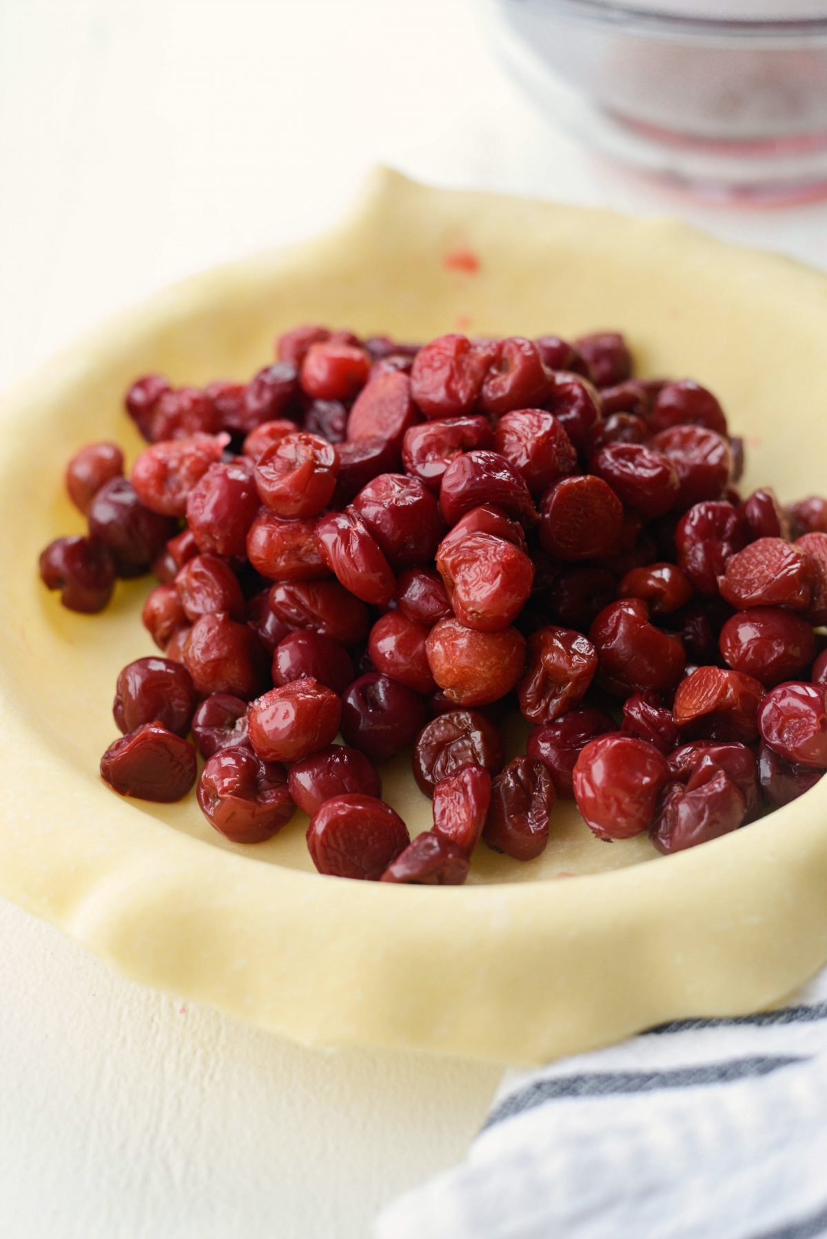 add drained cherries to pie crust