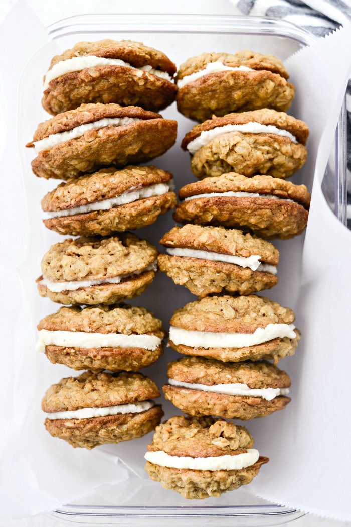 Homemade Oatmeal Cream Pies in a container.