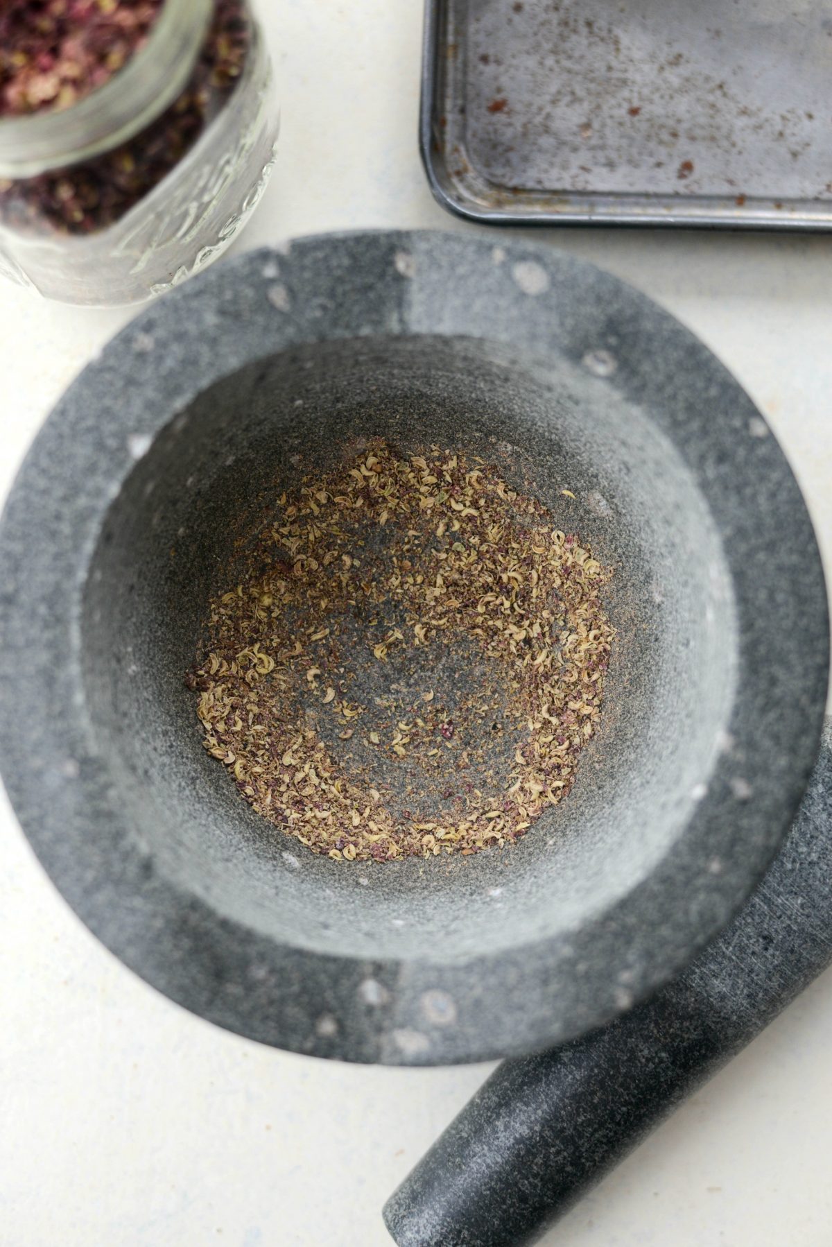 grind toasted hulls of Szechuan Peppercorns with pestle