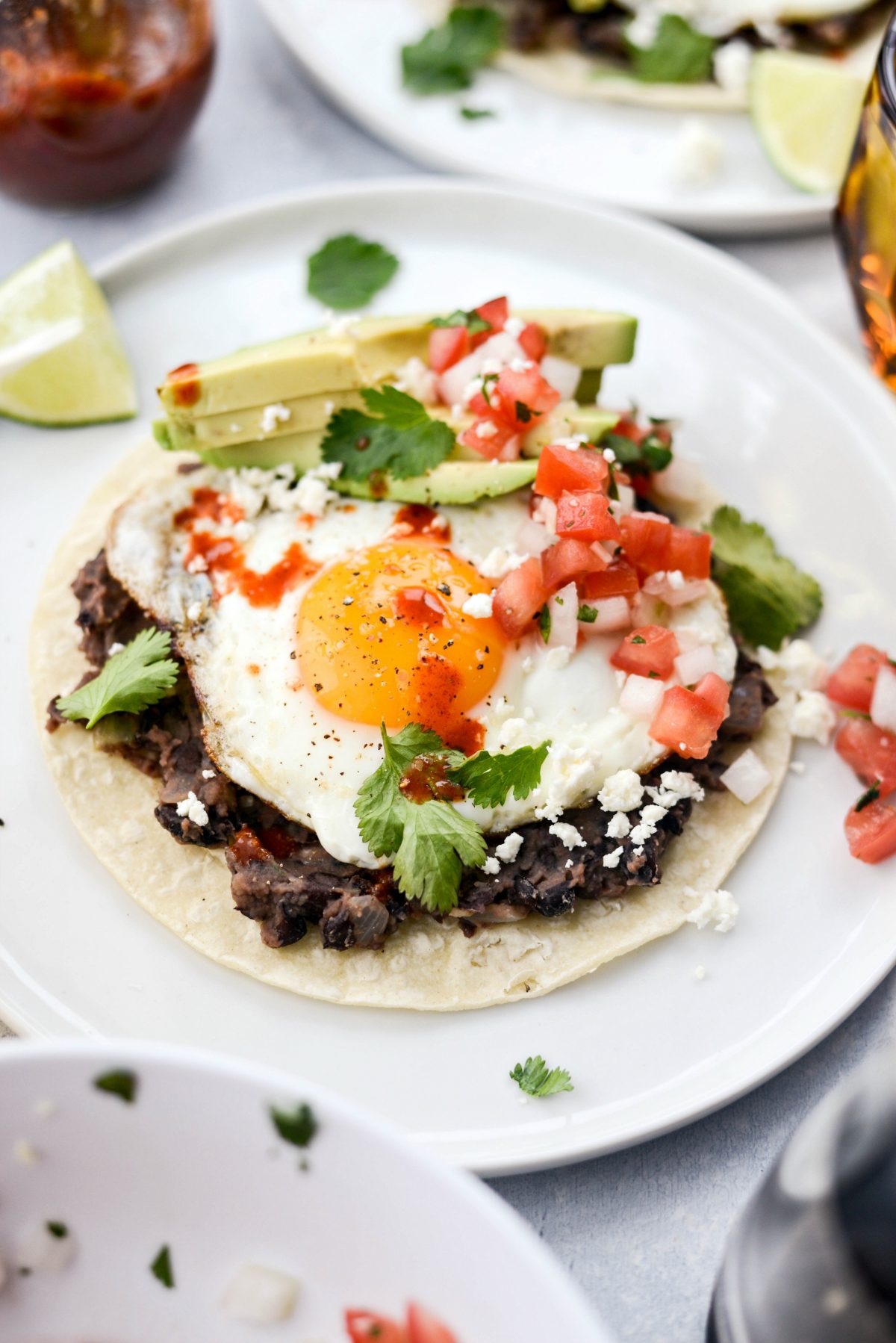 close up of Huevos Rancheros on white plate